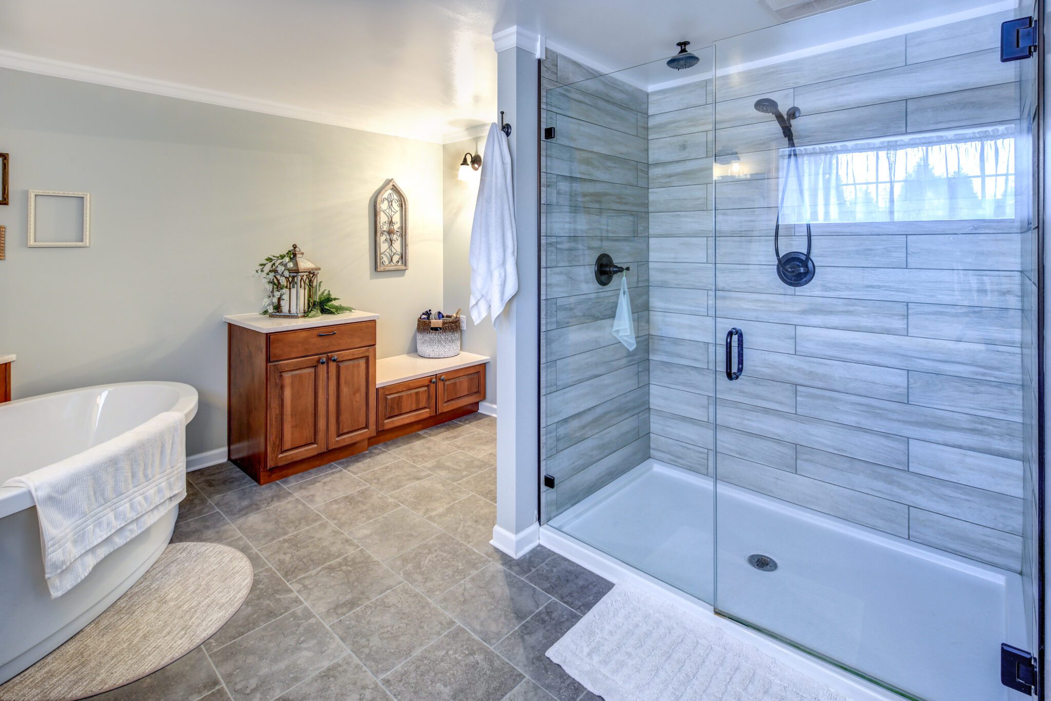 New shower glass doors in tile shower